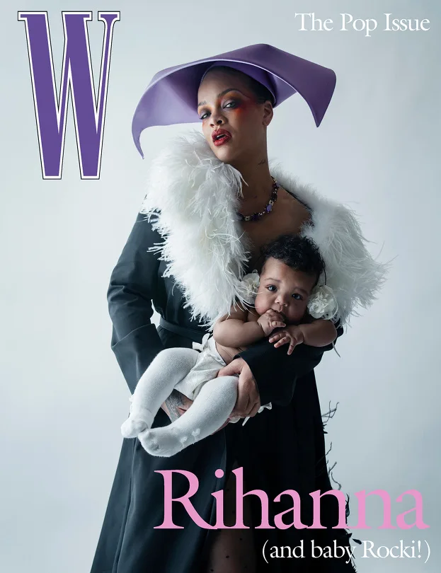 Rihanna holding a baby in a sculptural purple hat on a W Magazine cover photographed by Tim Walker